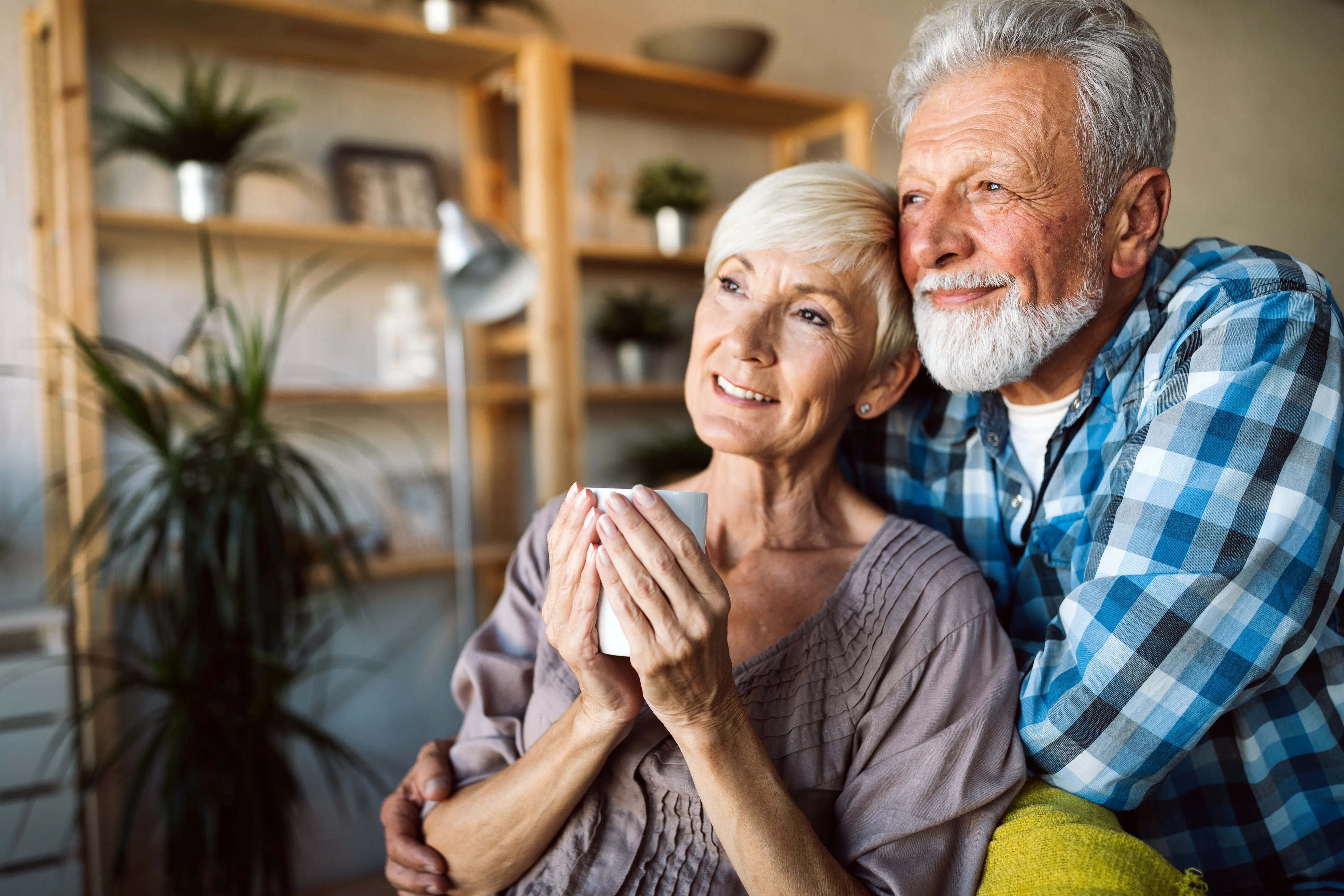 Relaxed retired couple at home
