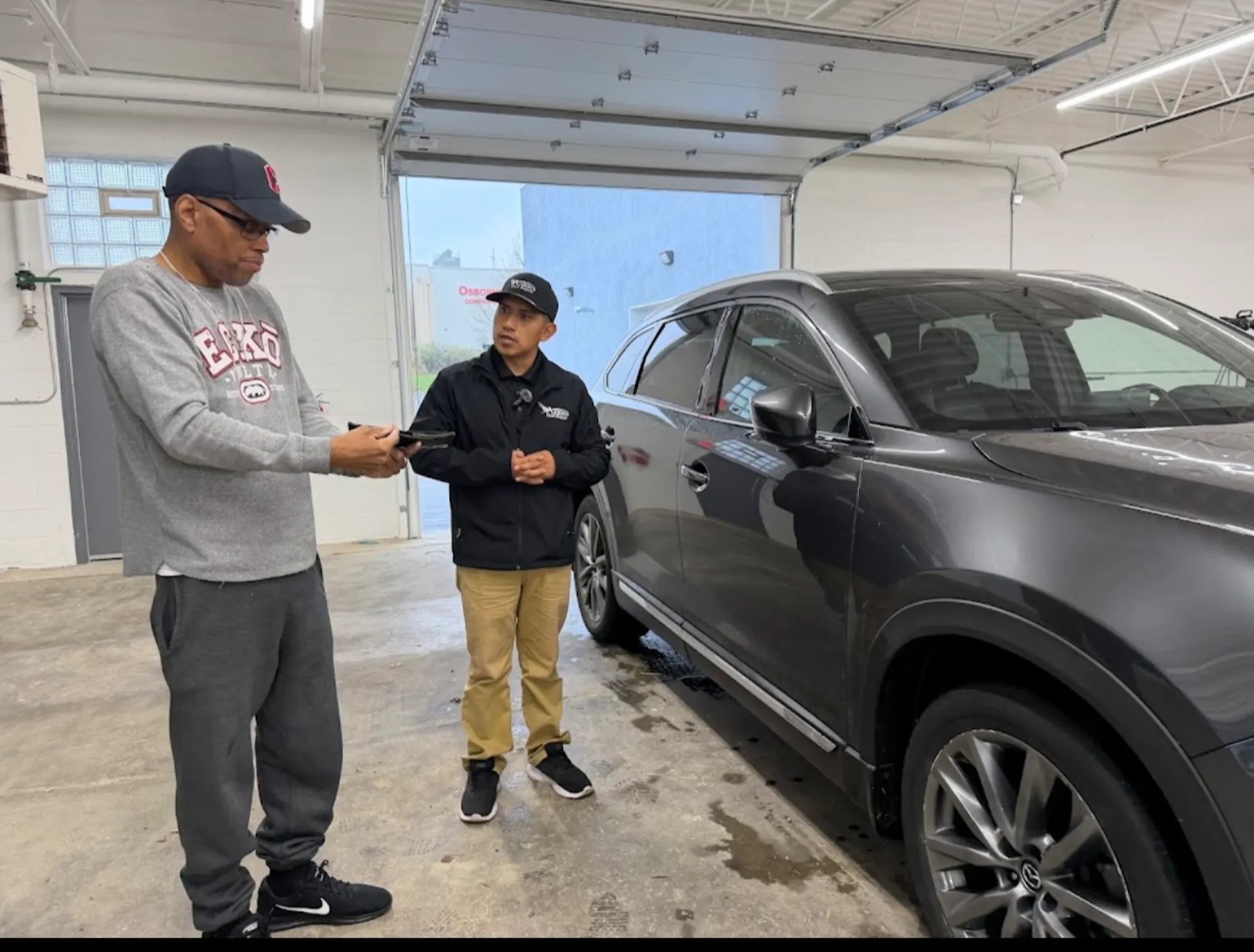 Customer collecting keys at partner shop