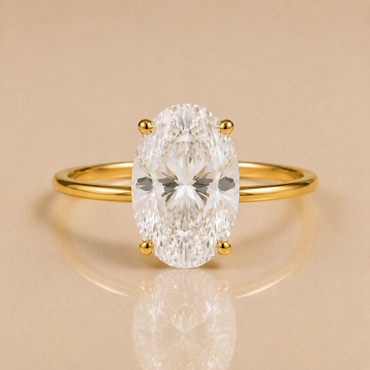 Oval-cut clear gemstone set in a four-prong yellow gold ring band with a reflective smooth surface underneath.