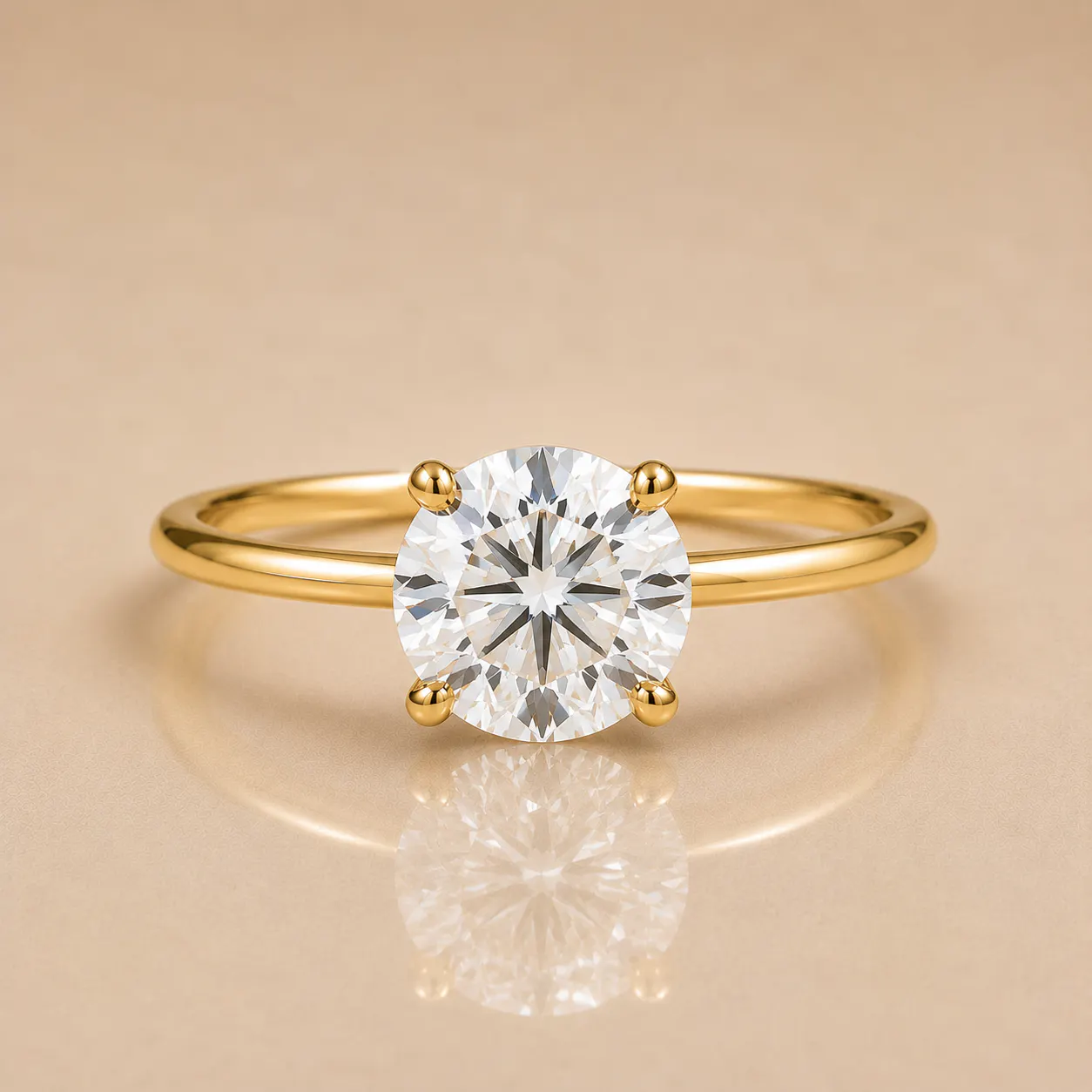 Round brilliant-cut diamond solitaire set in a four-prong yellow gold band on a reflective beige surface.