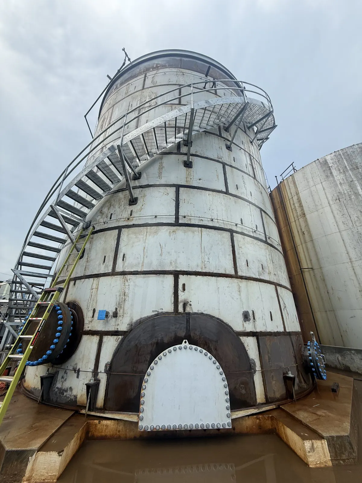 rusted streaked storage tank