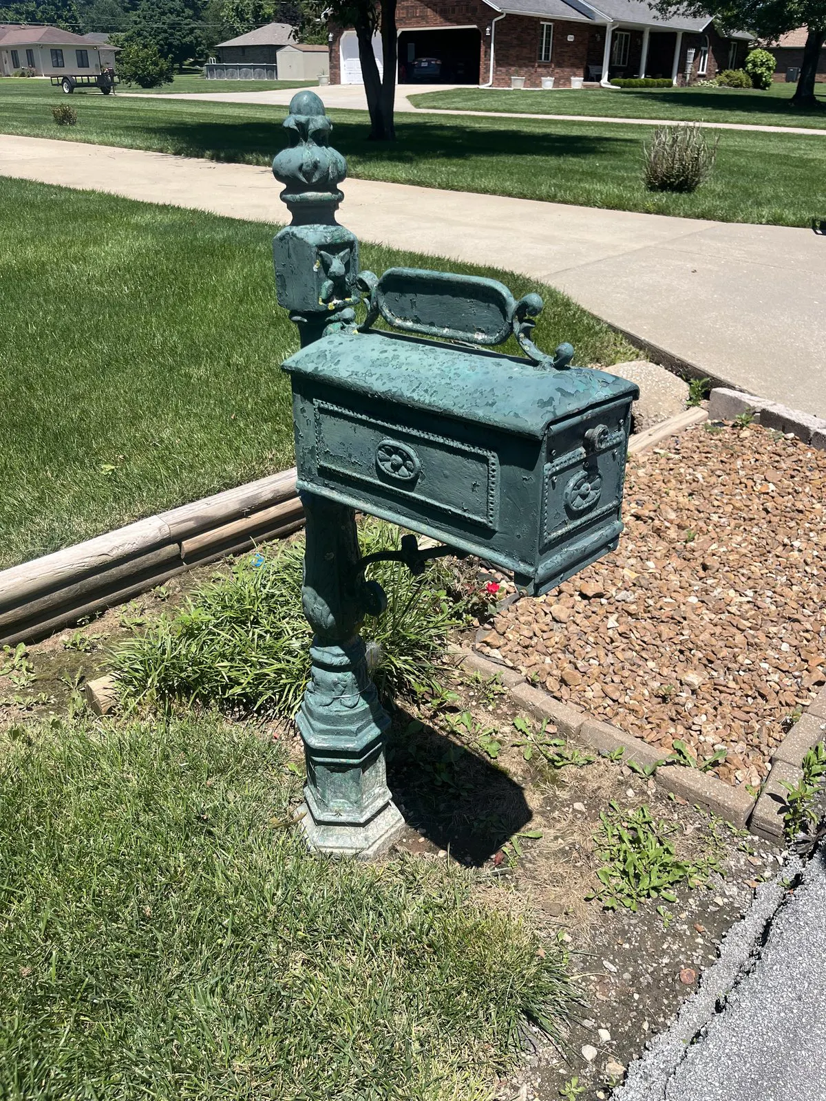 weathered corroded cast iron mailbox