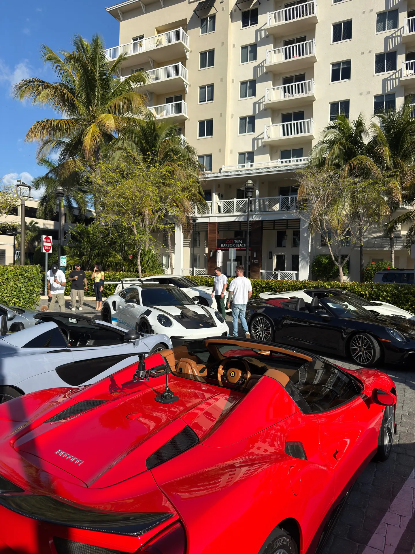 supercars parked outside