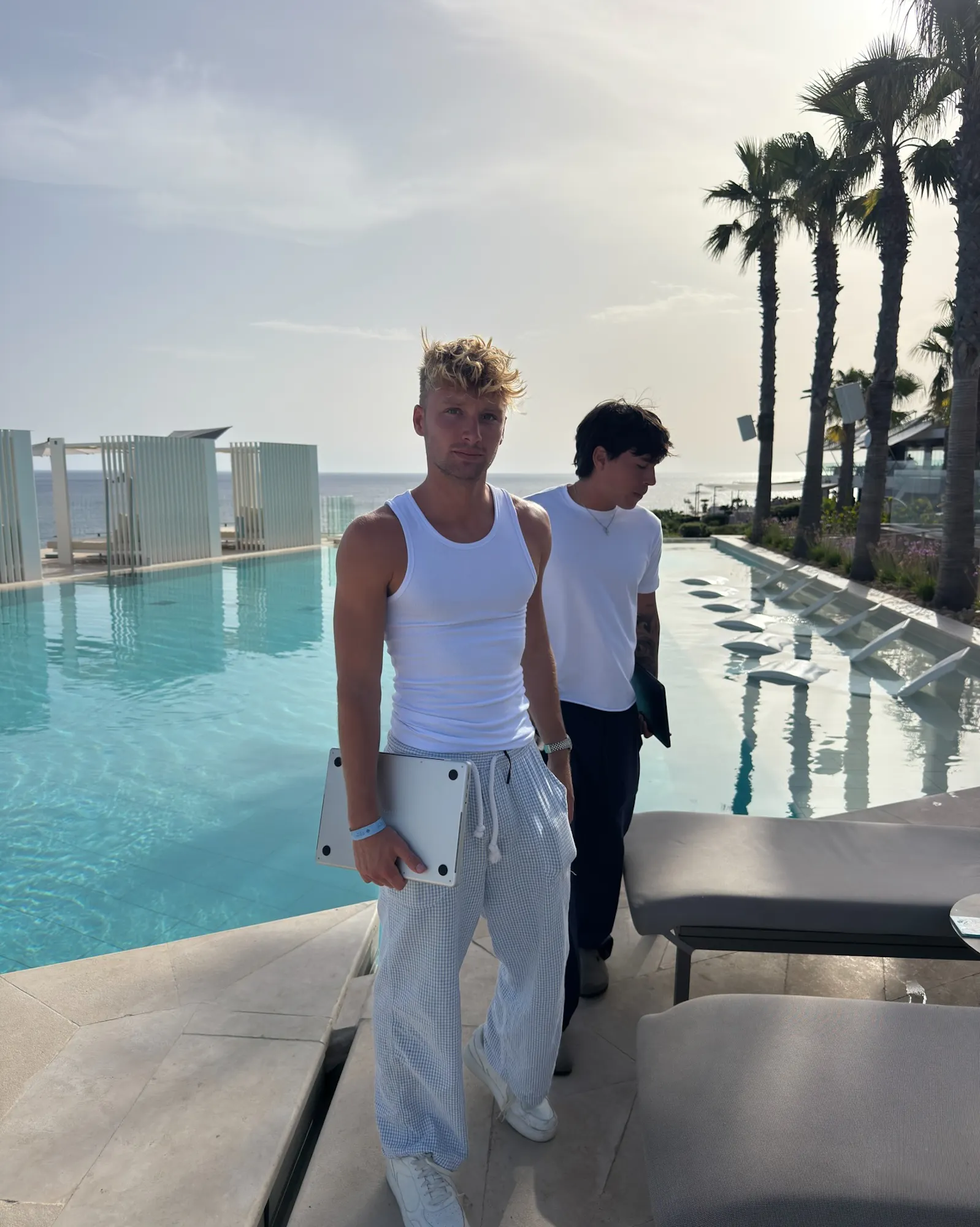 men by resort pool