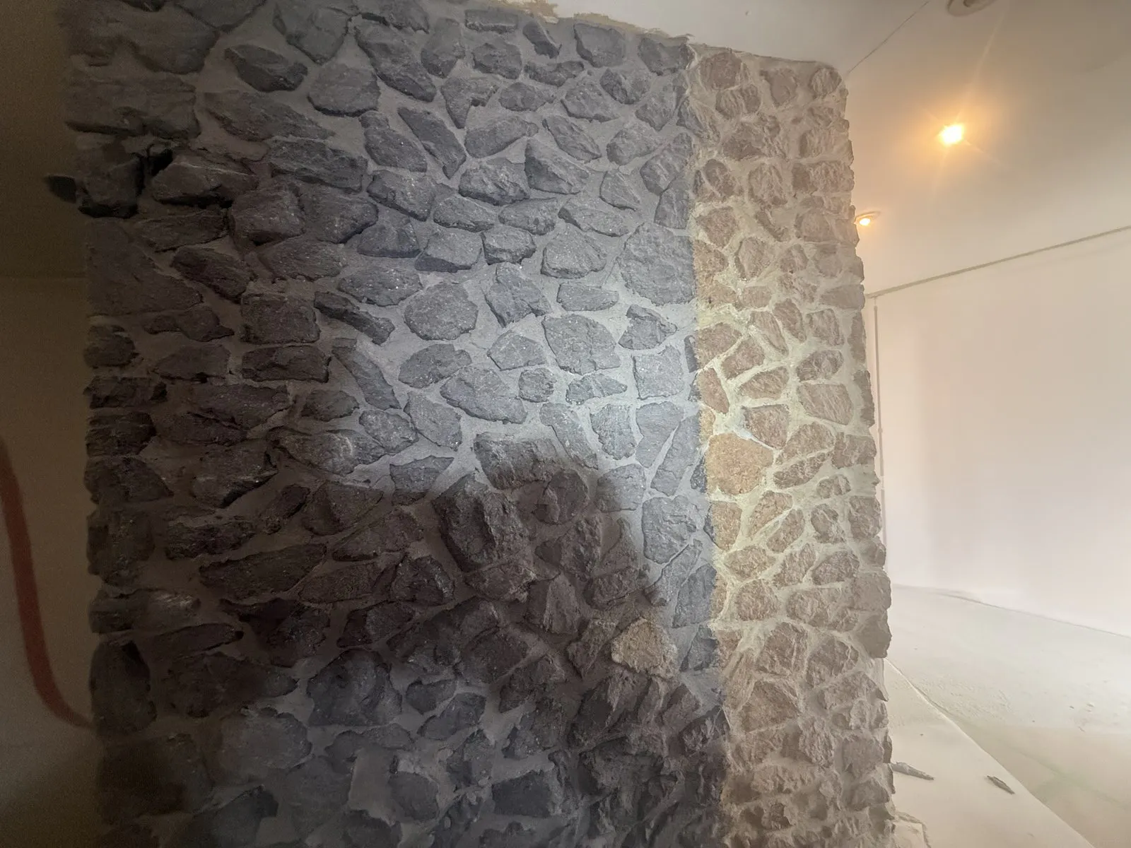 stone wall half cleaned
