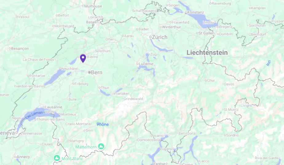 Map of Switzerland showing cities, borders, lakes, rivers, and a pin near Biel/Bienne northwest of Bern.
