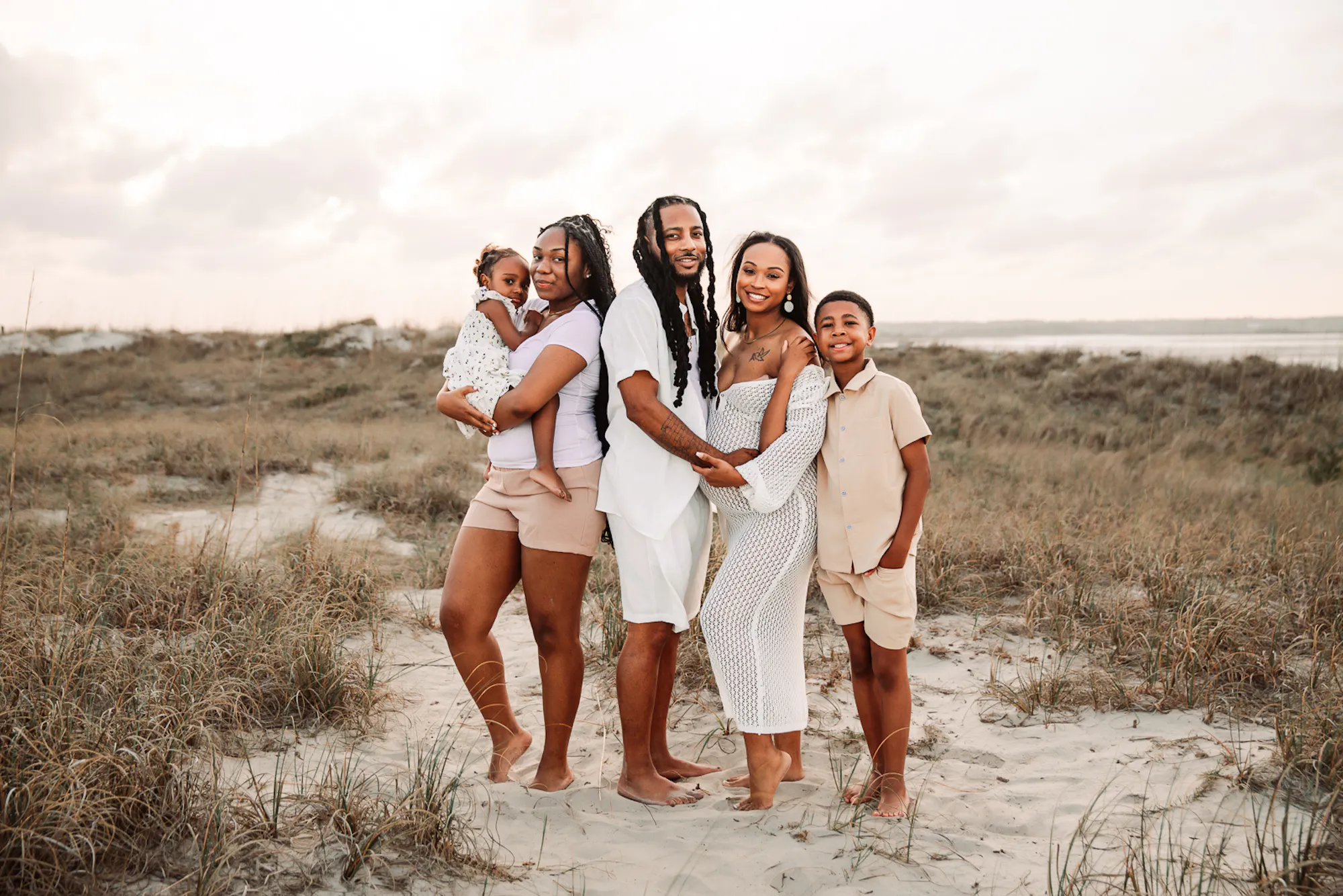 Family of five together on the beach