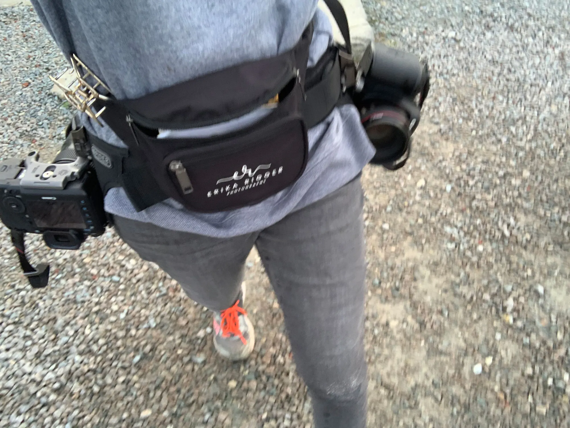 Photographer with two cameras on a dual belt system