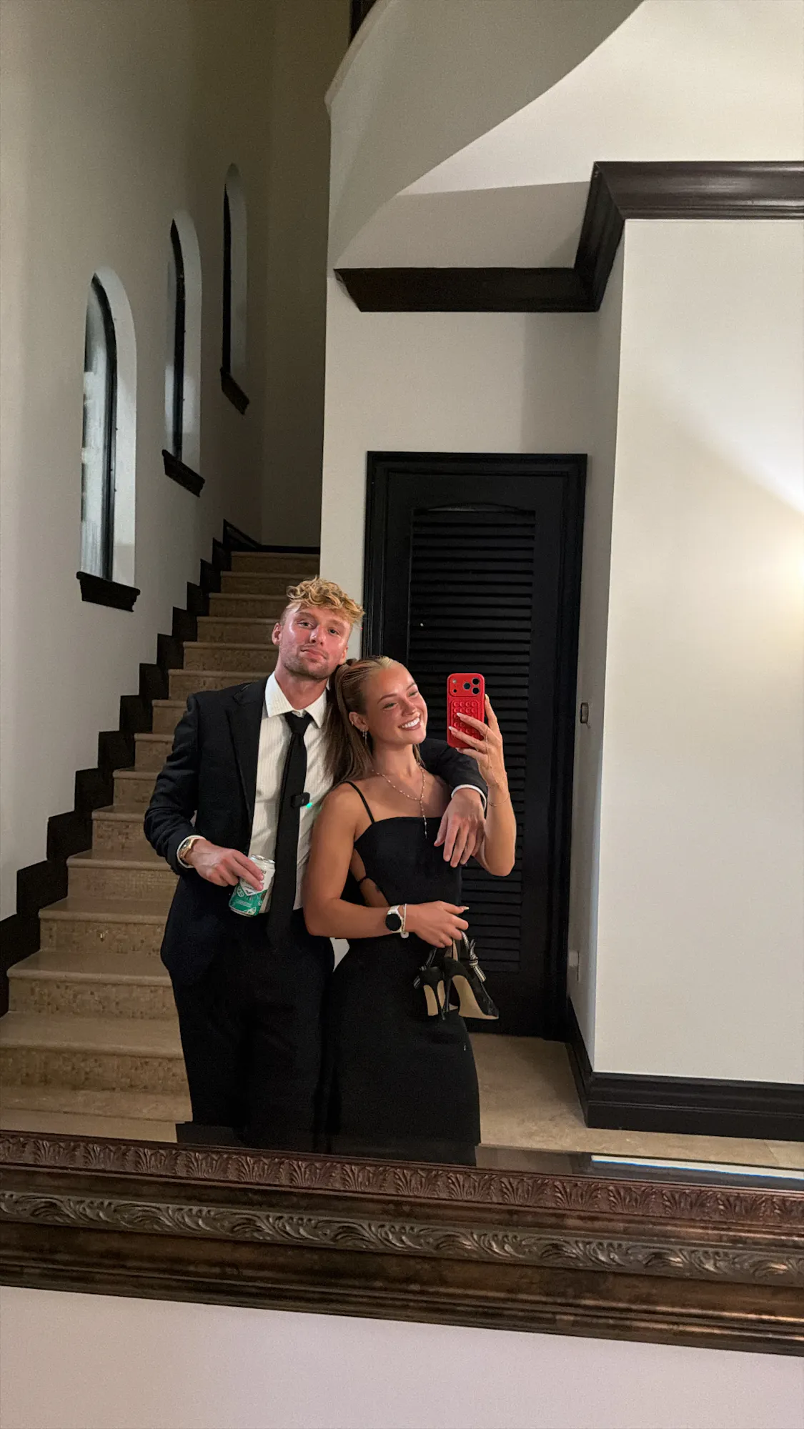 couple in formal wear on staircase