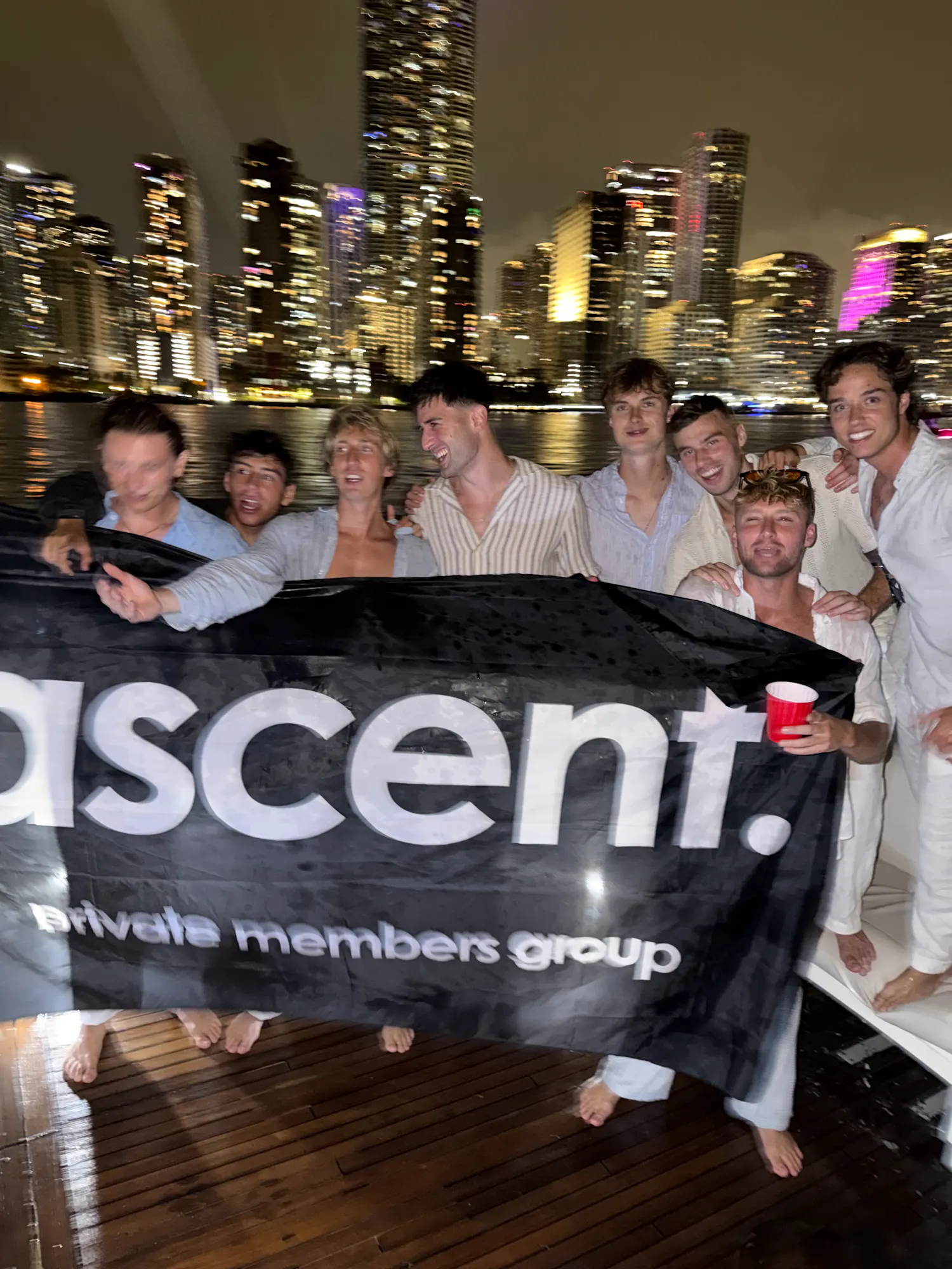 group holding banner with city skyline
