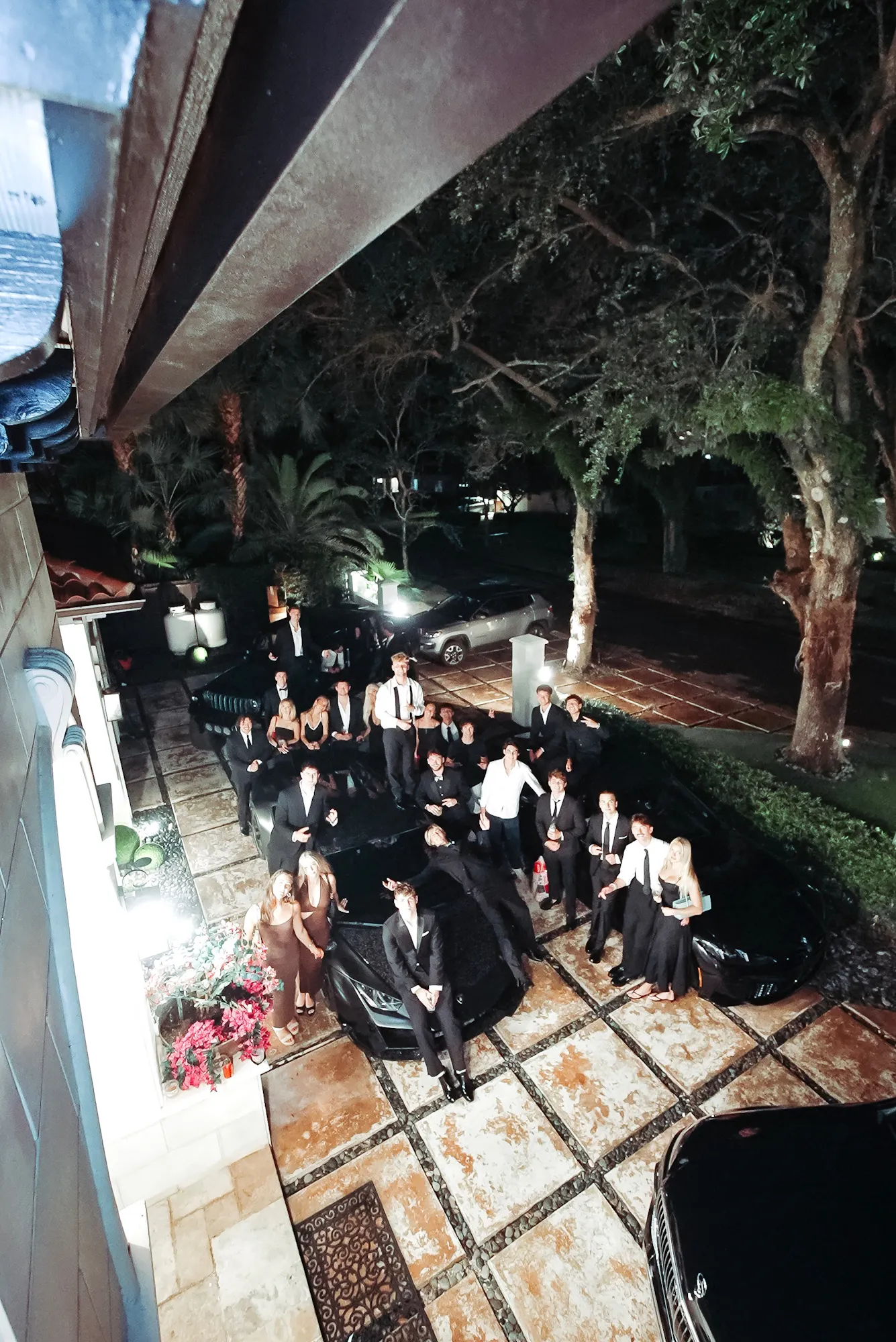 group with cars at night