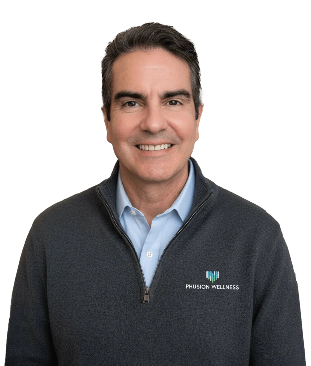Man wearing a dark gray zip-up sweater over a light blue collared shirt, smiling, with "PHUSION WELLNESS" logo on the sweater chest.