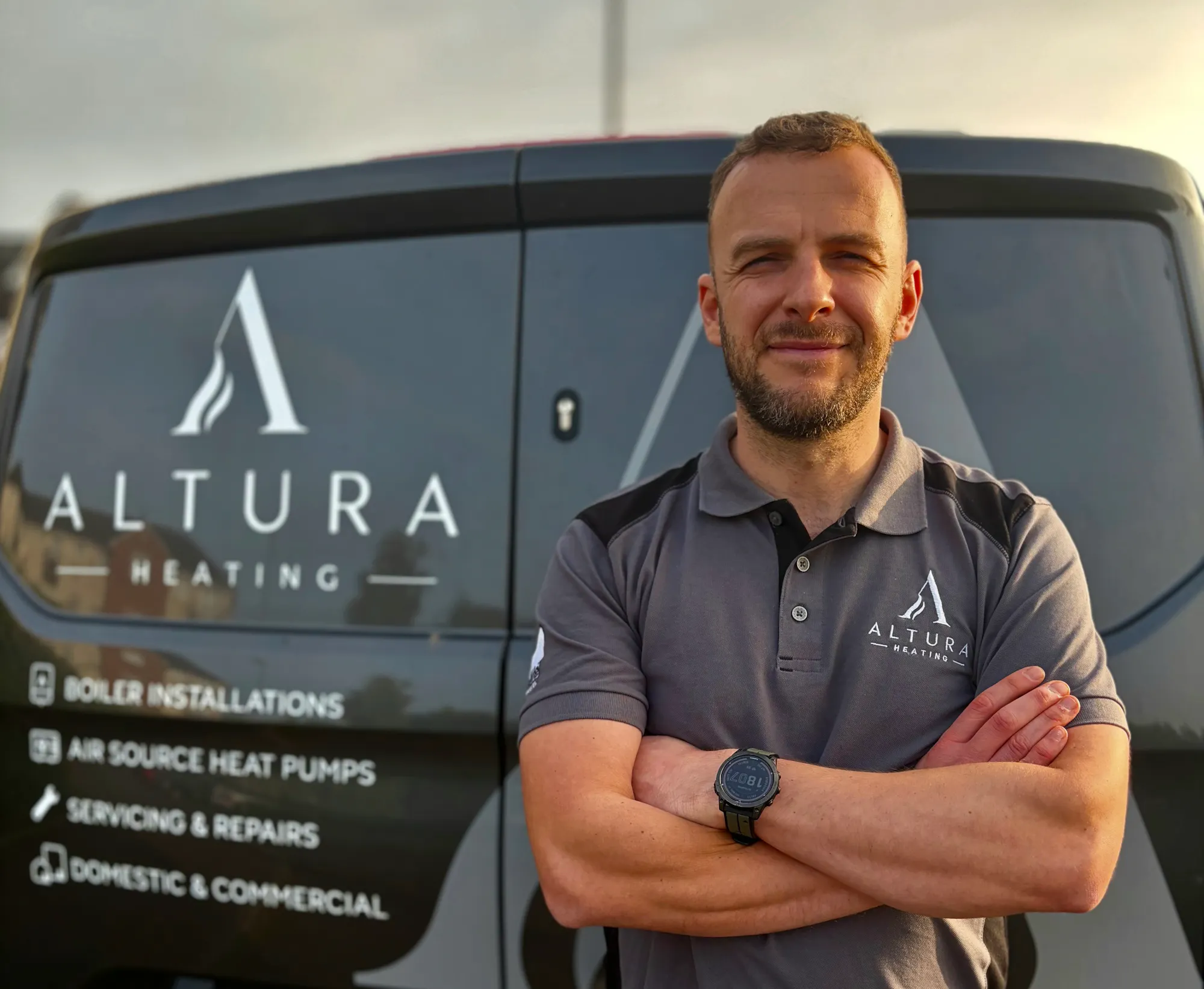 Gerard from Altura Heating in front of his branded van