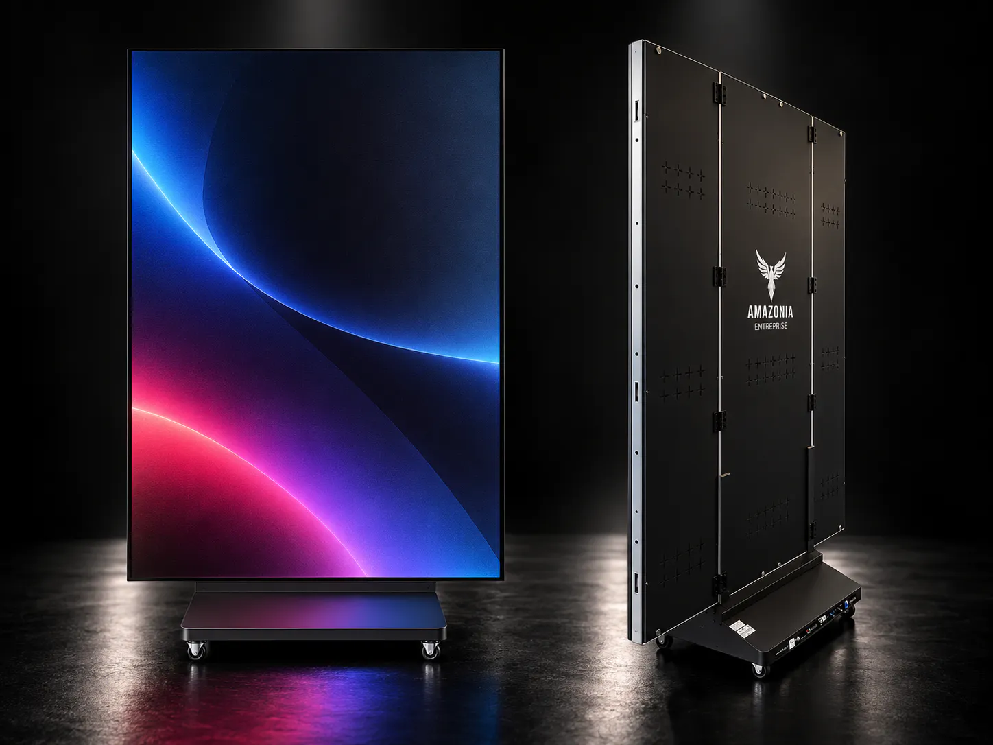 Two large vertical digital display panels on wheels, one facing front showing a colorful abstract design, the other showing the back with "Amazonia Entreprise" branding.